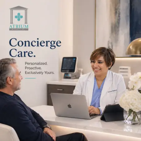 Dr. Shilpa Paradkar Singh, MD, founder and board-certified internist at Atrium Medical, consulting with a concierge medicine patient at the practice's Midtown Manhattan office.